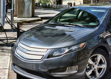 Electric car connected to charging equipment in Portland, Oregon